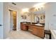 Double vanity bathroom with granite countertop at 13951 Caden Glen Dr, Hudson, FL 34669