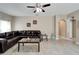 Living room with a large sectional sofa and access to other rooms at 13951 Caden Glen Dr, Hudson, FL 34669