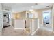 Upstairs hallway with access to bedrooms and bathrooms at 13951 Caden Glen Dr, Hudson, FL 34669