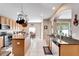 Spacious kitchen with island, granite countertops, and wood cabinets at 13951 Caden Glen Dr, Hudson, FL 34669