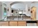 Kitchen features a breakfast bar overlooking the living room at 13951 Caden Glen Dr, Hudson, FL 34669