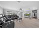Spacious living room featuring a sectional sofa and large TV at 5805 8Th Avenue W Dr, Bradenton, FL 34209