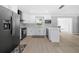 Modern kitchen with white cabinets and gray appliances at 5805 8Th Avenue W Dr, Bradenton, FL 34209