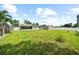 Spacious backyard with large grassy area and storage shed at 5805 8Th Avenue W Dr, Bradenton, FL 34209