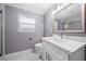Updated bathroom with white vanity and quartz countertop at 5805 8Th Avenue W Dr, Bradenton, FL 34209