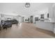 Open living room and kitchen with light grey walls and wood flooring at 5805 8Th Avenue W Dr, Bradenton, FL 34209
