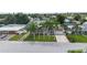 Aerial view of a ranch home with palm trees and driveway at 5805 8Th Avenue W Dr, Bradenton, FL 34209