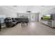 Living room with sectional sofa and large screen TV at 5805 8Th Avenue W Dr, Bradenton, FL 34209