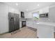 Modern kitchen with white cabinets and quartz countertops at 5805 8Th Avenue W Dr, Bradenton, FL 34209