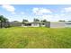 Spacious backyard with large grassy area and storage shed at 5805 8Th Avenue W Dr, Bradenton, FL 34209