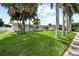 Ranch home with lush landscaping and palm trees at 5805 8Th Avenue W Dr, Bradenton, FL 34209