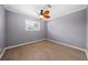 Bright bedroom with ceiling fan and wood-look flooring at 5805 8Th Avenue W Dr, Bradenton, FL 34209