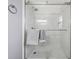 Large walk-in shower with marble tile and glass enclosure at 5805 8Th Avenue W Dr, Bradenton, FL 34209