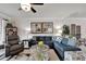 Spacious living room featuring a sectional sofa and a large window at 15641 Aurora Lake Cir, Wimauma, FL 33598