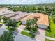 Luxury home with tile roof and two-car garage, aerial view at 15641 Aurora Lake Cir, Wimauma, FL 33598