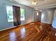 Living room with hardwood floors, light-blue walls and a ceiling fan at 14141 11Th St, Dade City, FL 33525