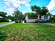 Front view of charming ranch home with lush lawn at 14141 11Th St, Dade City, FL 33525