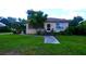 Brick ranch home with a walkway and landscaped yard at 14141 11Th St, Dade City, FL 33525