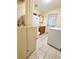 Laundry room with walk-in shower, toilet and sink at 14141 11Th St, Dade City, FL 33525