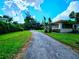 Long driveway leading to the front of the house at 14141 11Th St, Dade City, FL 33525