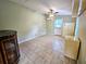 Spacious bedroom with tile floors and ceiling fan at 14141 11Th St, Dade City, FL 33525