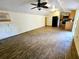 Open living room and kitchen area with laminate floors at 14141 11Th St, Dade City, FL 33525