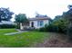 Brick ranch home with a walkway and landscaped yard at 14141 11Th St, Dade City, FL 33525