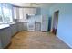 Updated kitchen with gray cabinets and tile floors at 14141 11Th St, Dade City, FL 33525