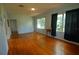 Bright living room with hardwood floors and large windows at 14141 11Th St, Dade City, FL 33525