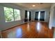 Living room with hardwood floors and large windows at 14141 11Th St, Dade City, FL 33525