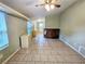Bright living room with hardwood floors and a ceiling fan at 14141 11Th St, Dade City, FL 33525