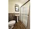 Bathroom with pedestal sink, toilet and shower at 14141 11Th St, Dade City, FL 33525