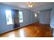 Bedroom with hardwood floors and large window at 14141 11Th St, Dade City, FL 33525