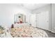 Bedroom with a floral comforter and large closet at 33668 Willow Point Ct, Wesley Chapel, FL 33545
