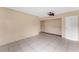 Bright bedroom featuring tile flooring, ceiling fan, and spacious closet at 15635 Bear Creek Dr, Tampa, FL 33624