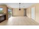 Bright dining room featuring tile flooring, sliding glass doors, and neutral-toned walls at 15635 Bear Creek Dr, Tampa, FL 33624