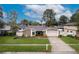 Charming single-story home with a well-manicured lawn and inviting curb appeal at 15635 Bear Creek Dr, Tampa, FL 33624