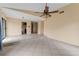 Bright living room with tile flooring, a ceiling fan, and neutral walls at 15635 Bear Creek Dr, Tampa, FL 33624