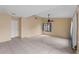 Open living room featuring tile flooring, neutral walls, and a ceiling fan at 15635 Bear Creek Dr, Tampa, FL 33624