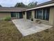 Spacious outdoor patio with sliding glass doors, perfect for entertaining and enjoying the backyard at 15635 Bear Creek Dr, Tampa, FL 33624