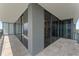 Spacious balcony featuring floor-to-ceiling glass windows and sleek tile flooring with ample room for seating at 2912 Santiago St # 1201, Tampa, FL 33629