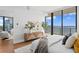 Bright bedroom showcasing a large window with stunning waterfront views and modern design at 2912 Santiago St # 1201, Tampa, FL 33629