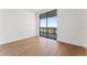 Bedroom with hardwood floors and large windows leading to a balcony at 2912 Santiago St # 1201, Tampa, FL 33629