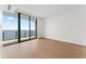 Bright bedroom with hardwood floors and large glass windows offering plenty of natural light and water views at 2912 Santiago St # 1201, Tampa, FL 33629
