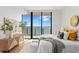 Serene bedroom featuring a large window with water views and neutral decor at 2912 Santiago St # 1201, Tampa, FL 33629