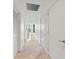 Hallway with marble floors leading to living area with water views at 2912 Santiago St # 1201, Tampa, FL 33629