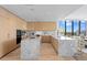 Modern kitchen boasts a marble island, light wood cabinetry and stainless steel appliances at 2912 Santiago St # 1201, Tampa, FL 33629