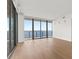 Bright living room featuring hardwood floors and large windows providing natural light and picturesque water views at 2912 Santiago St # 1201, Tampa, FL 33629