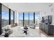 Modern living room with stylish decor, hardwood floors, and floor-to-ceiling windows at 2912 Santiago St # 1201, Tampa, FL 33629