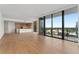 Open living area with hardwood floors, a modern kitchen, and floor-to-ceiling windows providing lots of natural light at 2912 Santiago St # 1201, Tampa, FL 33629